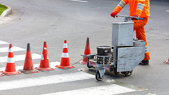 road worker, orange overalls, marks, renews, pedestrian, crossing lane, power trolley, cones, markings, road, copy space, pedestrian crossing, traffic cones, section of road, crossing, traffic, construction, street, asphalt, marking, urban, industrial, line, equipment, industry, white, security, occupation, spray, highway, surface, professional, reflective, beads, paint, crossroads, business, outdoor, machine, airbrush, light, infrastructure, hand, lines, dividing, manual, orange, repair, updates, painting